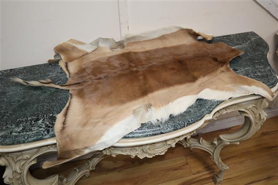 A pony skin rug and four goat skin mats, pony skin, 200 x 180cm